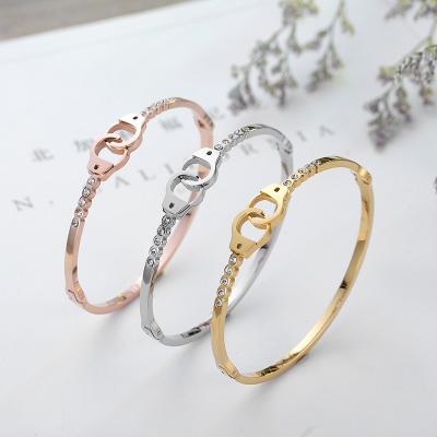 China Trendy simple trendy men and women hand personality stainless steel handcuffs couple bracelet zircon gold plated non-fading bracelet for sale