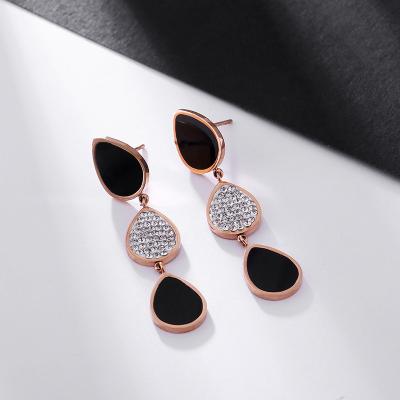 China Trendy Black and White Two Tone Personality Stainless Steel Drop Direct Selling Crystals Tassel Earrings White Women Jewerly Earrings for sale