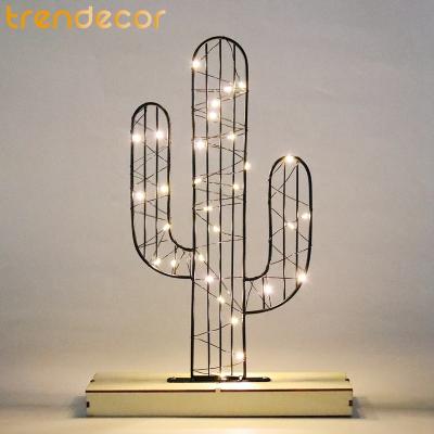 China Trendecor Christmas Decorative Lamp Iron Battery Operated Light Wooden Base Cactus View LED Warm White Light Up Metal Christmas Light for sale