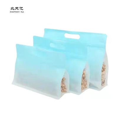 China Moisture Proof Plastic Clear Sealing Food Packaging Bags 8 Sides Sealed Holder Up Packaging Pouch With Handle for sale