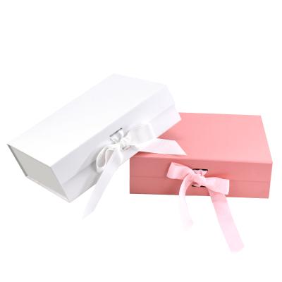 China Recycled Materials Custom Book Shaped Luxury Pink Magnetic Lid Folding Foldable Cardboard Packaging Paper Gift Box With Ribbon for sale