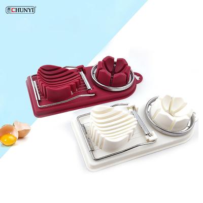 China Viable Wholesale Kitchen Tool Egg Slicer 2 In 1 Stainless Steel Egg Cutter For Boiling Eggs for sale