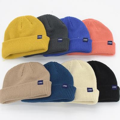 China UG COMMON Custom Knit Beanie Winter Acrylic Slouchy Cap Streetwear Private Woven Label Logo Beanies Fisherman Skull Hats for sale