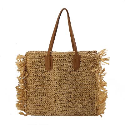 China Hot Sale Straw One Shoulder Bag Purses Fashion and Style Handmade Straw Handbag With Tassel Summer Beach Boho Woven Handbags for sale