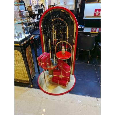 China Luxury Metal Fashion Metal Frame And Red Acrylic Decoration For Gift Box Free Floor Standing Display for sale