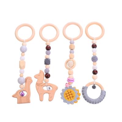 China Baby Toys 4Pcs/Set Chewable Baby Teether Set Hook Baby Teether Gym Frame Wooden Hanging Ring Teethers Molar Nursing Toys Gifts for sale