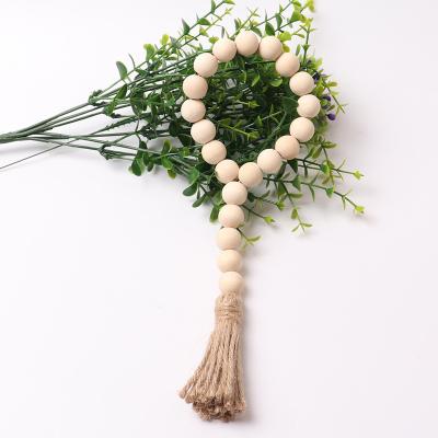 China Europe Wood Beads Garland with Tassels Farmhouse Rustic Natural Wooden Bead Twine Wall Hanging for sale