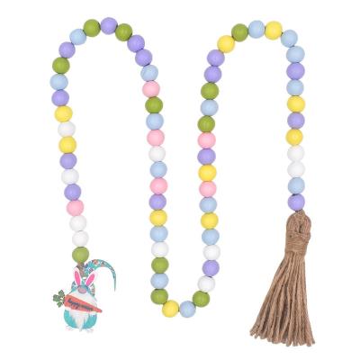 China Bohemia Handmade Rustic Transitional Wall Hanging Crafts Colorful Wooden Bead Garland With Tassels Easter Christmas Home Decor for sale