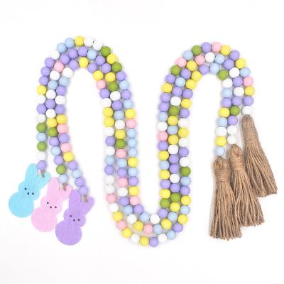 China Traditional Custom Rustic Farmhouse Beads Colorful Wooden Bead Garland with Tassels for Gifts Decorations Easter Christmas Home Decor for sale