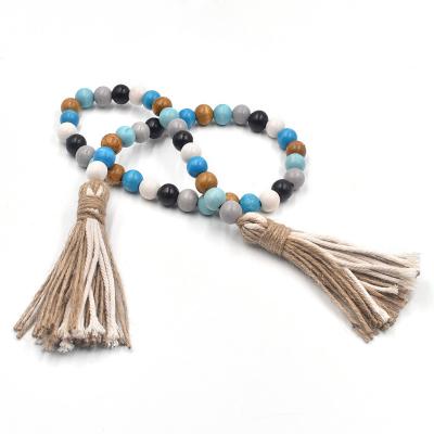 China Farmhouse Rustic Color Wooden Bead Garland with Tassel for Home Decor Accessories for sale