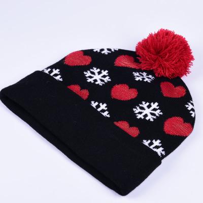 China Black and Red Christmas Pom Pom Hat Custom Christmas Hat Dobby Knit Pom Pom Beanie Snowflake Jacquard Hat for sale