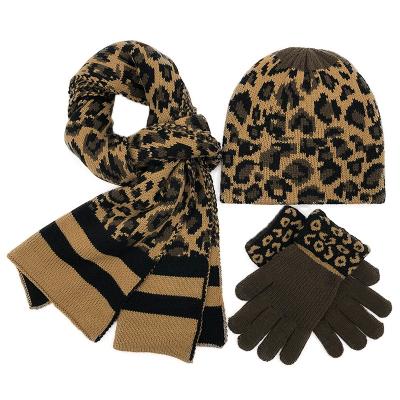 China Dobby Hats Scarves and Gloves Sets Women 3pcs Winter Leopard Knit Warm Beanie Hat Scarf Set Faux Fur Pom Pom Pom for sale