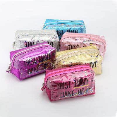 China New high quality DAIDAIMU fashion PVC fashion bag glitter cosmetic handbag transparent cosmetic bag for sale