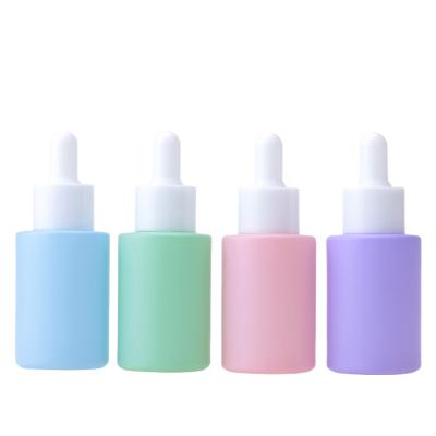 China Skin Care Cosmetic Packaging Colored Pump Bottles Glass Pump Lotion Bottle for sale