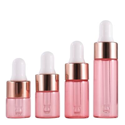 China Cosmetic glass vial in stock! 1ml 2ml 3ml 5ml rose gold dropper bottle rose essential oil glass bottle for sale