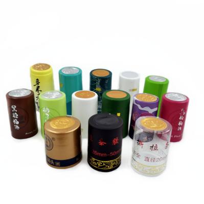 China Custom Logo Bottle Top Shrink Capsules 65mm PVC Heat Shrink Wrap For Wine Bottles for sale