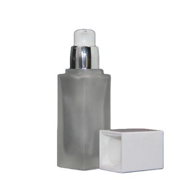 China Personal care 30ml empty glass pump bottle for sale