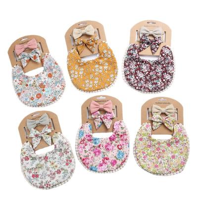 China Cotton Sustainable and Washable Bibs Cute Floral Newborn Baby Bow Bib Set for sale