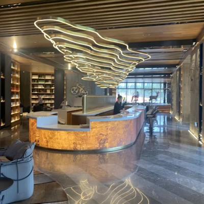 China Custom modern commercial decoration cloud modern mountain stainless steel building office space restaurant hall banquet chandelier for sale