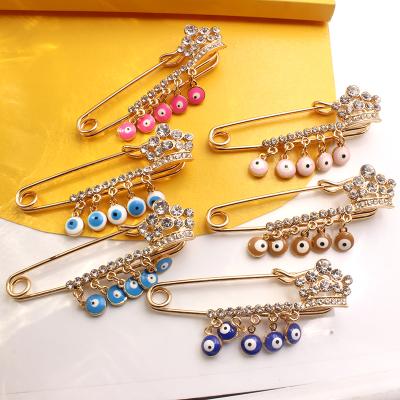 China Decoration Plated Gold Turkey Artifact Pin Brooch Small Blue Eyes Pants Belt Hot Elastic Change for sale