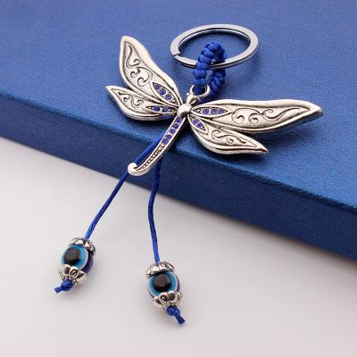 China Handwoven Turkey Inlaid Blue Eye Retro Promotion Gift Rope Dragonfly With Blue Rhinestone Bag Key Small Chain Pendant Gift for sale