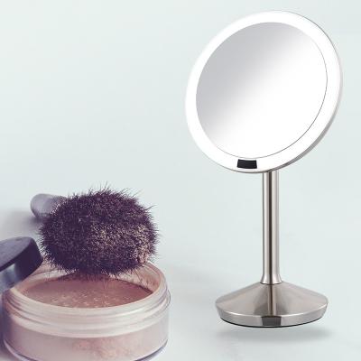 China Lighted Sensor Makeup Mirror Bathroom Desktop Mirror With LED Light Metal HD Mirror High End Smart Glass for sale