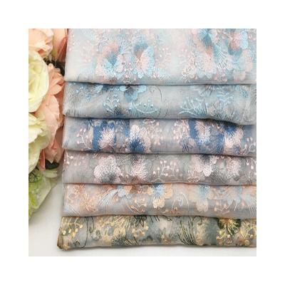 China Sustainable 100% Polyester Wonderful Flower Embroidered Fabric Mesh Lace Dressing Textiles For Children&Women Clothes for sale