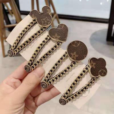 China Heavy industry four hair accessories fashion hair accessories Mickey clover leaf leather fringe hair clip female print metal hair clip for sale