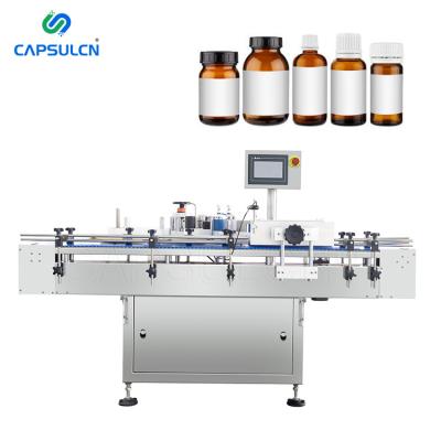 China Sticker Medical Automatic Horizontal Paper Label Sticking Machine Round Bottle Self Adhesive Plastic Side Labeling Machine for sale