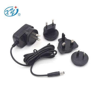 China Electrical Appliances...Xing Yuan World Plug Adapter AC Adapter 12v 500Ma Interchangeable Power Supply Adapter for sale