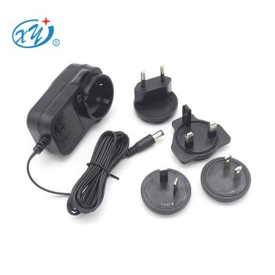 China 12V 2A 24V 1A International Universal Multiple Socket Interchangeable DC to AC Adapter with CB CE ETL RCM SAA XY24SE-120200VQ-ZW for sale