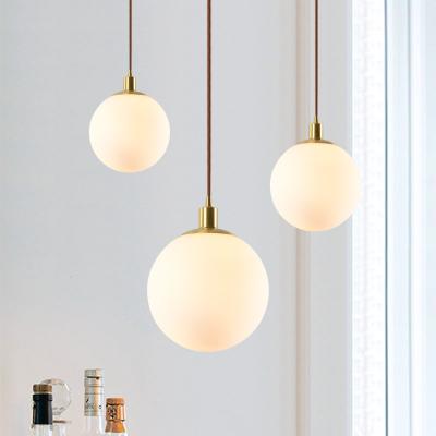 China Modern Nordic glass spherical chandelier personality creativity pendant lamp bedroom bedside clothing store restaurant brass bar for sale