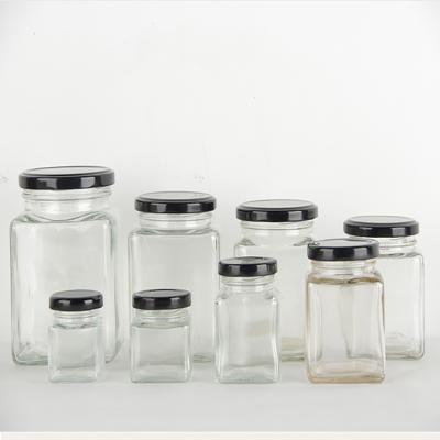 China Empty Square Amber Glass Jars Honey Jar Glass Frascos de vidrio Glass freshness storage square for honey for sale