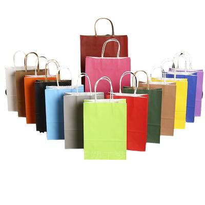 China Industrial Surface Packaging Kraft Paper Gift Bag with Handle Customized Logo Printing for sale