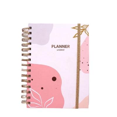 China Paper Cover Custom Logo A5 Pink Spiral Weekly Monthly Manifestation Goal Diary Journal Planner Agenda Notebook for sale