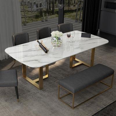 China Customizable modern stone stainless steel gold design italy top luxury rectangular dining table set 8 seater for sale