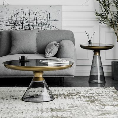 China Modern transparent gray metal frame top tempered glass round small living room table set stained glass coffee table for sale