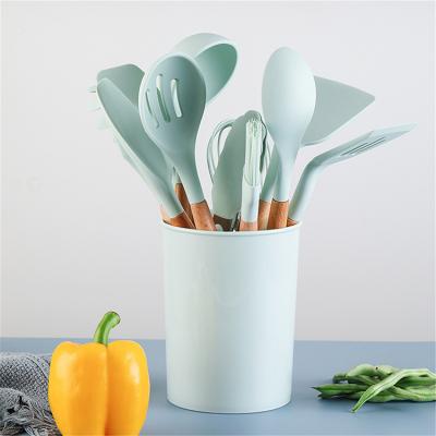 China Sustainable 12 Pieces In 1 Set Silicone Cooking Accessories Kitchen Tools Wood Handle Spoons Kitchen Utensil Set for sale