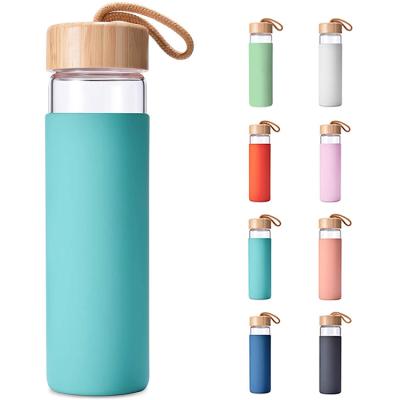 China 20oz lid glass water bottle sustainable portable bamboo sports wholesale eco friendly drinks bottle with custom logo for sale for sale