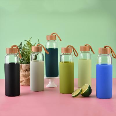 China Custom Wholesale Logo Clear Glass Water Bottle Viable Bpa Free With Bamboo Lid for sale