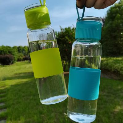 China Amazon Viable Hot Fancy Borosilicate Glass Bpa Free Colored Drinking Water Bottle With Silicone Sleeve for sale