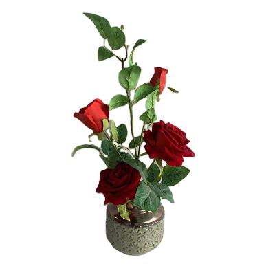 China Realistic/Long Lasting Potted Artificial Rose Flowers in Gold Flower Pot Ceramic Red Roses Bonsai Trees for sale