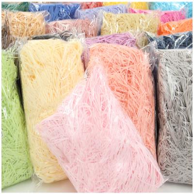 China Wholesale High Quality Decorative Raffia Shredded 50g/Bag Box Filler Moisture Proof Shredded Paper For Gift Box Filler for sale