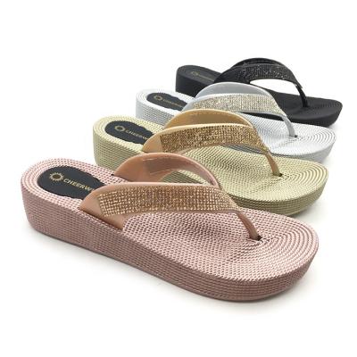 China Hot Style 2021 Fashion Trend Rhinestone Flip Flops Ladies Full Wedge Straw Botton Slippers Summer Beach Slides for sale