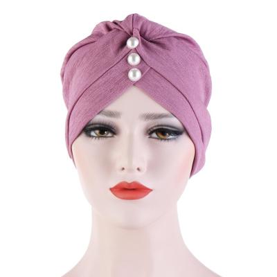 China 2021 fashion Tudung amazon headscarf solid color simple front snap fold bawal bead india muslim hat cap hijab tudung cotton inner for sale