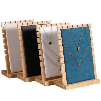 China Jewelry Shows Bamboo and Wood Pendant Jewelry Display Props Window Jewelry Counter Ornaments Holder Necklace Display Rack for sale