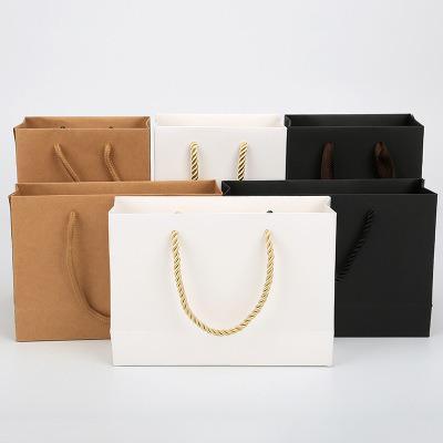 China Recycled materials wholesale high quality cheap custom logo paper bag paper bags for sale