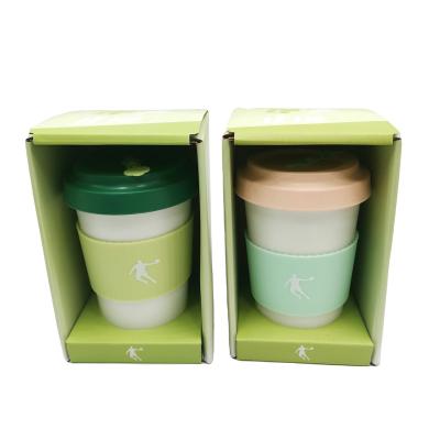 China Sustainable 16 OZ 450 ml white color bamboo fiber cups with green bamboo lid white logo printed on silicone band coffee mugs for sale