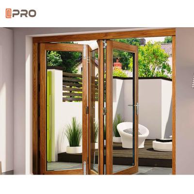 China Custom Veranda Exterior Accordion Aluminum Bifold Door Glass Sliding Patio Door for sale