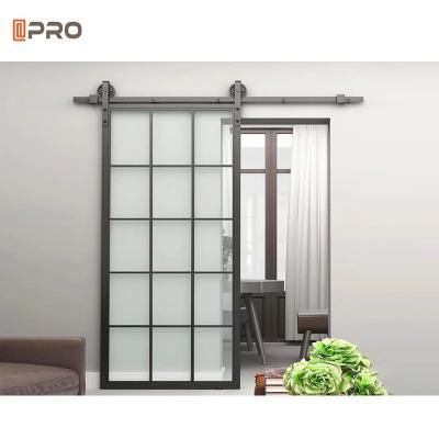 China La pista ocultada moderna manual de las puertas interiores duplicó la puerta de granero de desplazamiento de cristal moderada de aluminio en venta